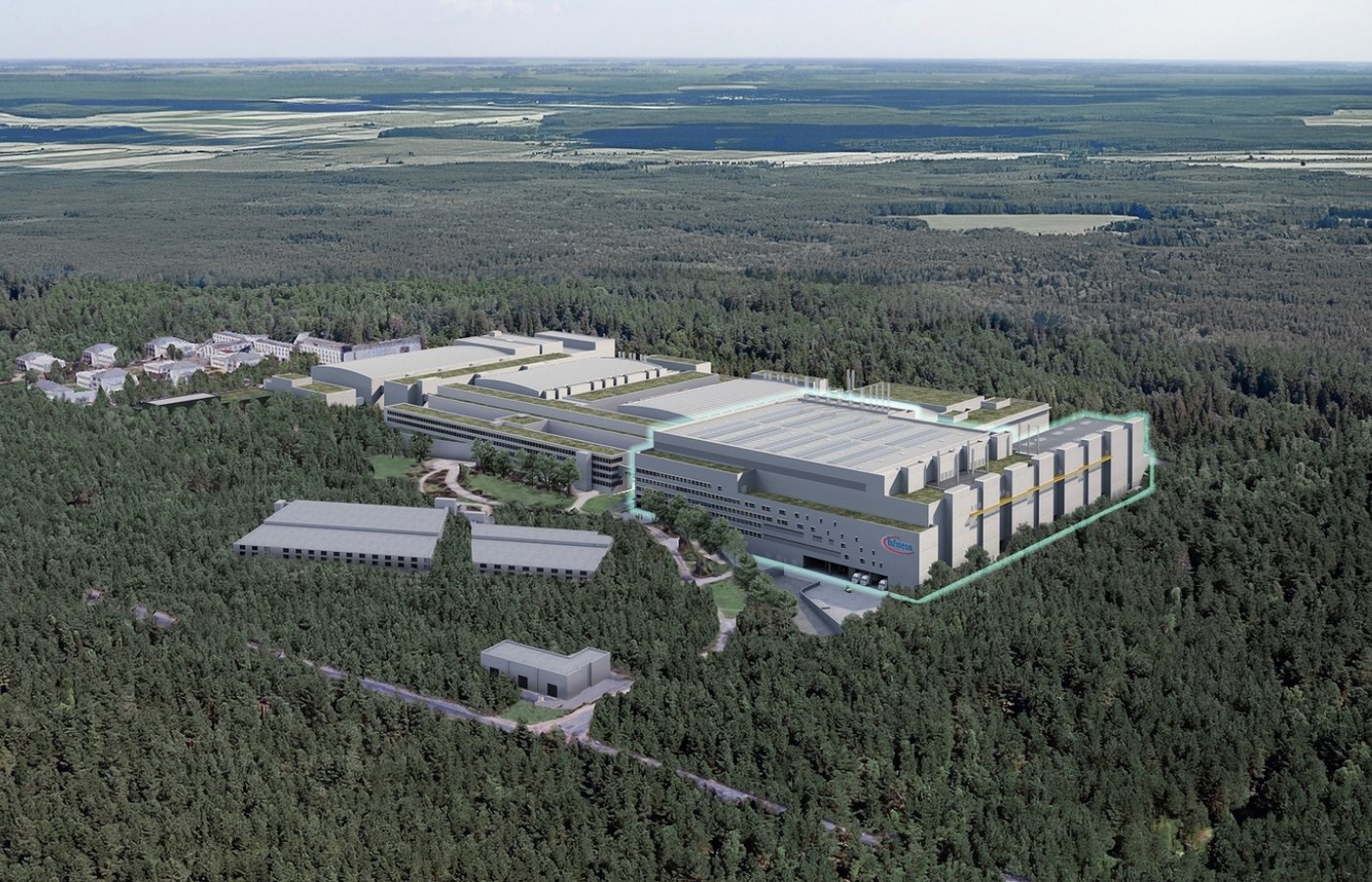 Drohnenaufnahme eines Industrieunternehmens umgeben von Wald.